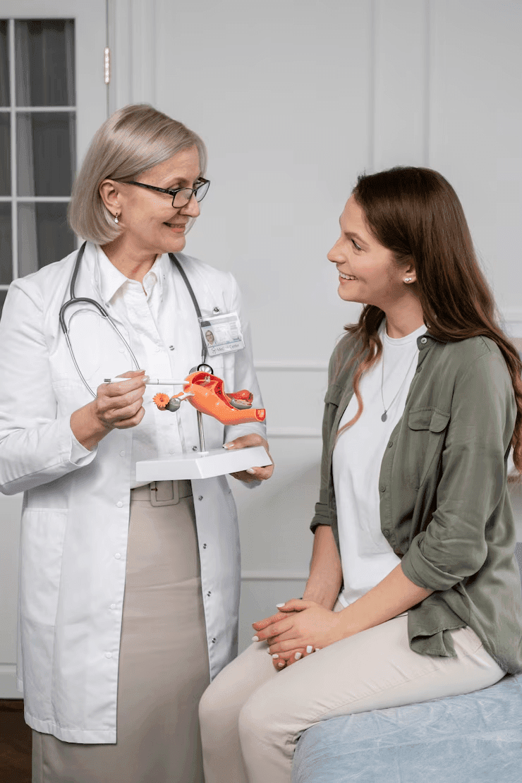  Doctor explaining gynecological care to a patient at Prakash Hospital.