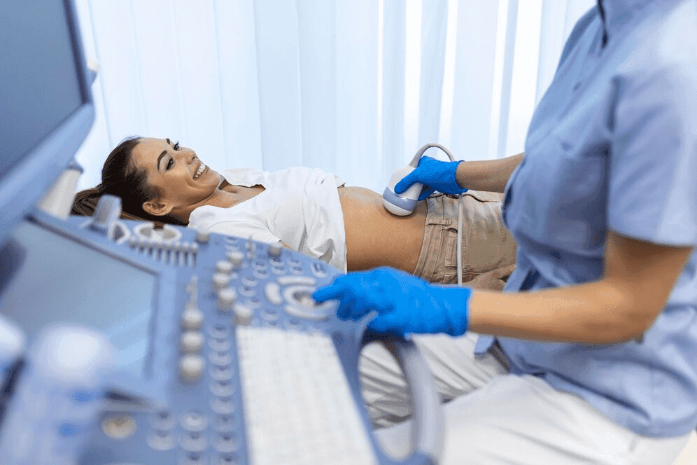 Doctor conducting an ultrasound examination for a patient at Prakash Hospital.