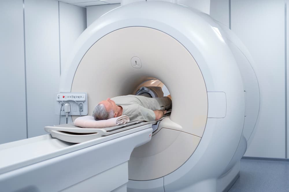 Neuroscience doctors rushing a patient for an MRI scan at Prakash Hospital.
