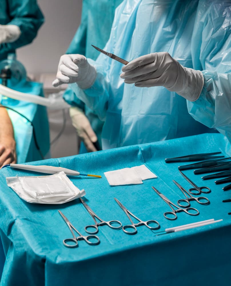 Surgeon sterilizing medical instruments before surgery at the General Surgery Department of Prakash Hospital.