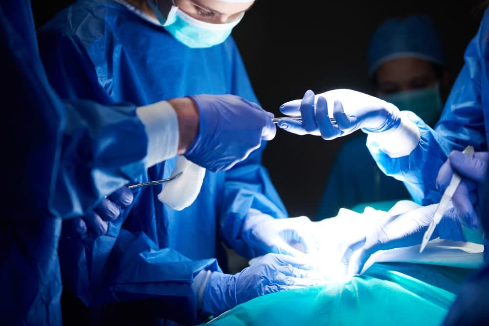 Surgeon performing surgery to remove kidney stones in the Urology Department of Prakash Hospital.